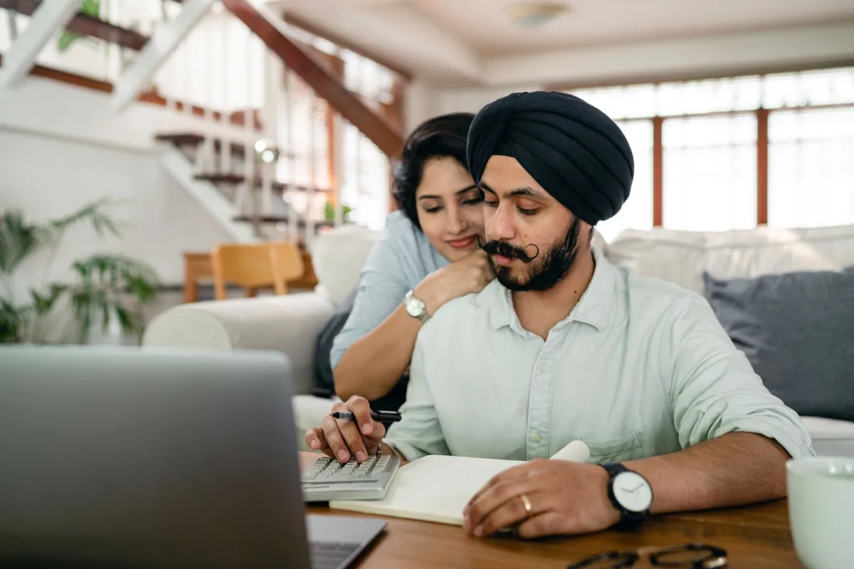 A couple working through their finances together at home