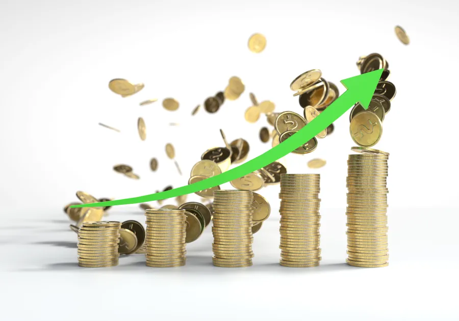 Rising stacks of gold coins with a green arrow curving upwards